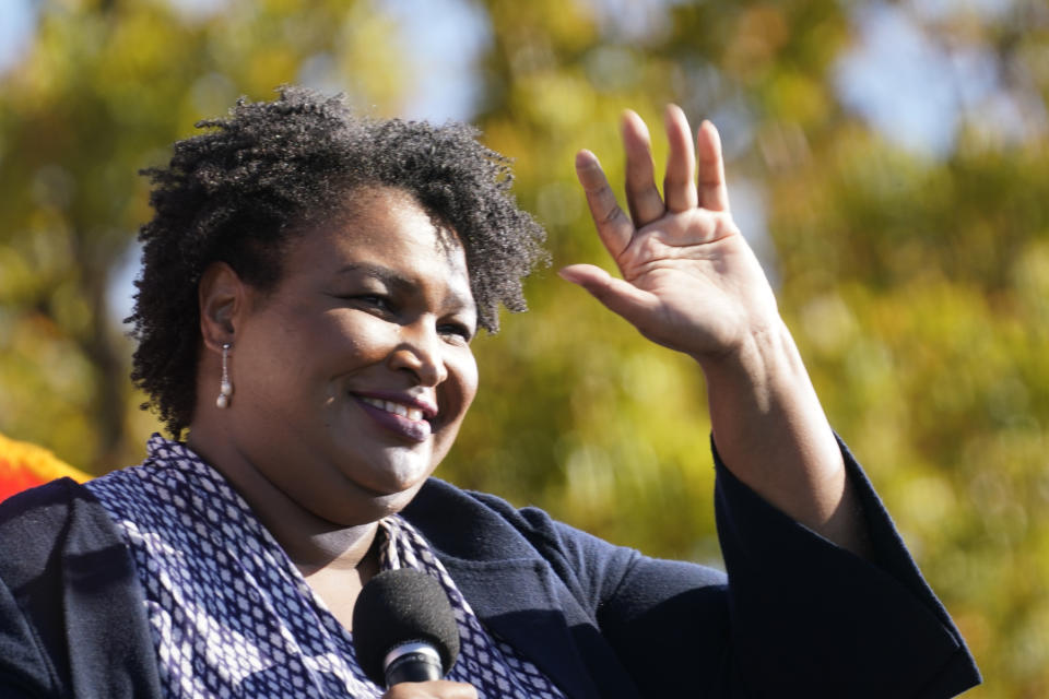 FILE - In this Monday, Nov. 2, 2020, file photo, Stacey Abrams speaks to Biden supporters as they wait for former President Barack Obama to arrive and speak at a campaign rally for Biden at Turner Field in Atlanta. Abrams is expected to make another gubernatorial run in 2022. Boosted by President Biden's win and two U.S. Senate victories, high-profile Democratic candidates in Georgia are running for statewide office in a way unseen in years. Seven sitting Democratic lawmakers have already declared candidacies for one of Georgia’s eight statewide offices — a full nine months away from the 2022 qualifying deadline. (AP Photo/Brynn Anderson, File)