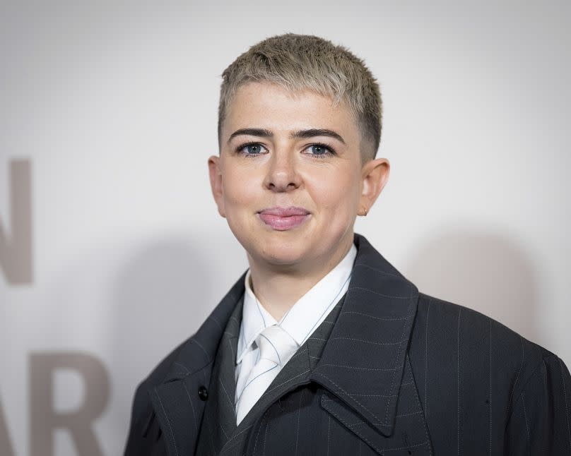 Molly Manning Walker poses for photographers upon arrival at the GQ Men of the Year Awards in London, Wednesday, Nov. 15, 2023.