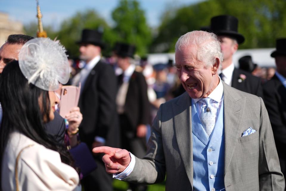 Charles spoke cordially with many attendees at the garden party at Buckingham Palace (PA Wire)