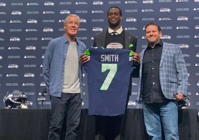 Coach Pete Carroll, Geno Smith, general manager John Schneider after the Pro Bowl quarterback signed his three-year contract extension with the Seahawks at team headquarters in Renton March 9, 2023.