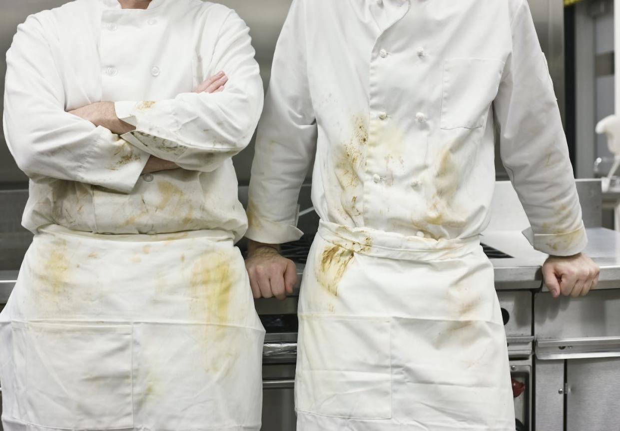 Many restaurant workers see violence as a core aspect of a hardscrabble kitchen culture that has existed for generations. <a href="https://www.gettyimages.com/detail/photo/dirty-chefs-leaning-against-stove-royalty-free-image/84303248?phrase=busy+restaurant+kitchen&adppopup=true" rel="nofollow noopener" target="_blank" data-ylk="slk:Jetta Productions/David Atkinson via Getty Images;elm:context_link;itc:0;sec:content-canvas" class="link ">Jetta Productions/David Atkinson via Getty Images</a>