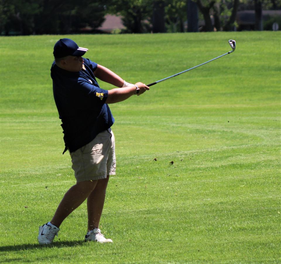 Airport's Connor McGregor hits a shot off the fairway during the Monroe County Championship Monday.