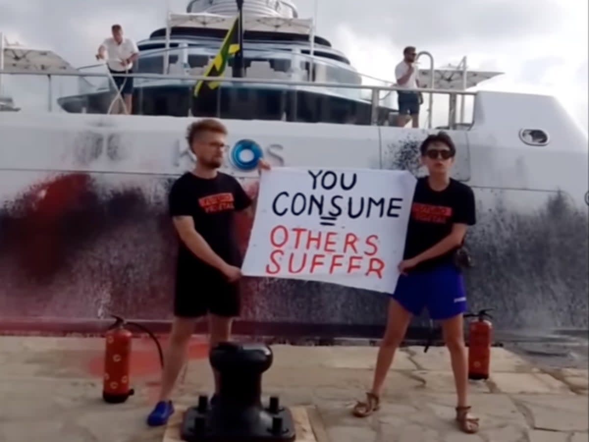 Activists from environmental group Futuro Vegetal sprayed paint on a superyacht owned by Walmart heiress Nancy Walton Laurie which was docked in Ibiza on Sunday 16 July 2023 (Futuro Vegetal/Instagram)