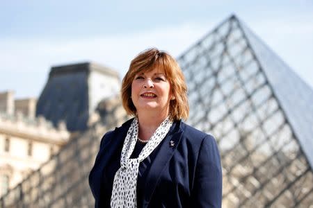 Scotland's external affairs minister Fiona Hyslop poses in front of the Louvre Pyramid designed by Chinese-born U.S. Architect Ieoh Ming Pei in Paris, France, September 26, 2016. REUTERS/Charles Platiau