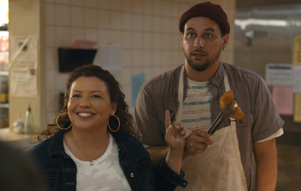 two people in a restaurant kitchen