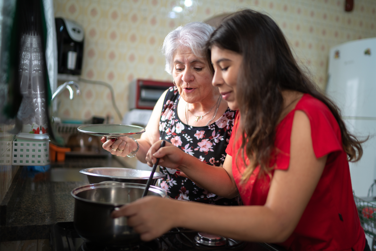 Grandmother and granddaughter cooking