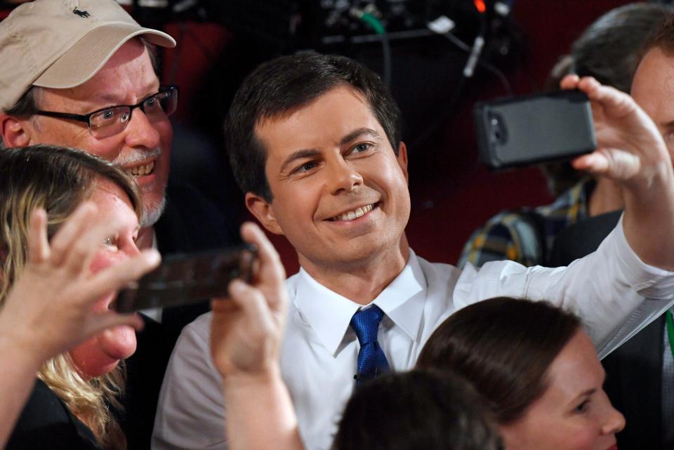 Democratic presidential candidate South Bend, Ind., Mayor Pete Buttigieg takes a selfie with audience members after a FOX News Channel town hall, Sunday, May 19, 2019, in Claremont, N.H.