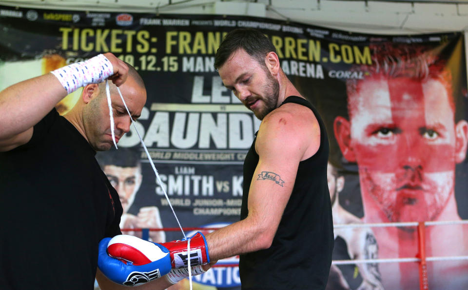 Andy Lee (R) and his trainer Adam Booth during a media work-out at Arnie’s Gym (Photo by Dave Thompson/Getty Images)