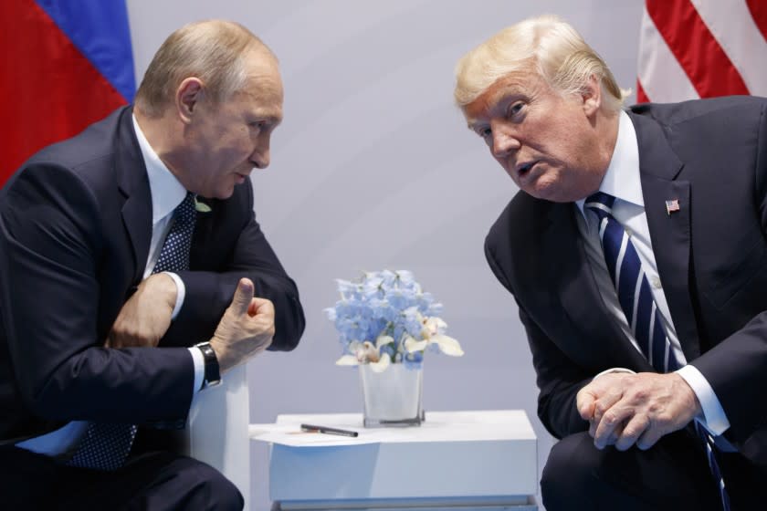 FILE - In this Friday, July 7, 2017, file photo U.S. President Donald Trump meets with Russian President Vladimir Putin at the G-20 Summit in Hamburg. The Kremlin and the White House have announced Thursday, June 28, 2018, that a summit between Russian President Vladimir Putin and U.S. President Donald Trump will take place in Helsinki, Finland, on July 16. (AP Photo/Evan Vucci, File)