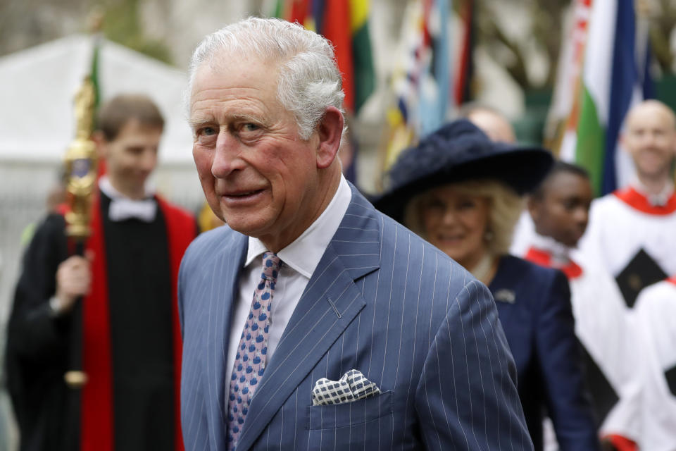 FILE - In this Monday, March 9, 2020 file photo, Britain's Prince Charles and Camilla the Duchess of Cornwall, in the background, leave after attending the annual Commonwealth Day service at Westminster Abbey in London. There will be dissenters among the cheering crowds when King Charles III travels by gilded coach to his coronation. More than 1,500 protesters will be dressed in yellow for maximum visibility and they plan to gather beside it to chant “Not my king” as the royal procession goes by on Saturday, May 6, 2023. (AP Photo/Kirsty Wigglesworth, File)