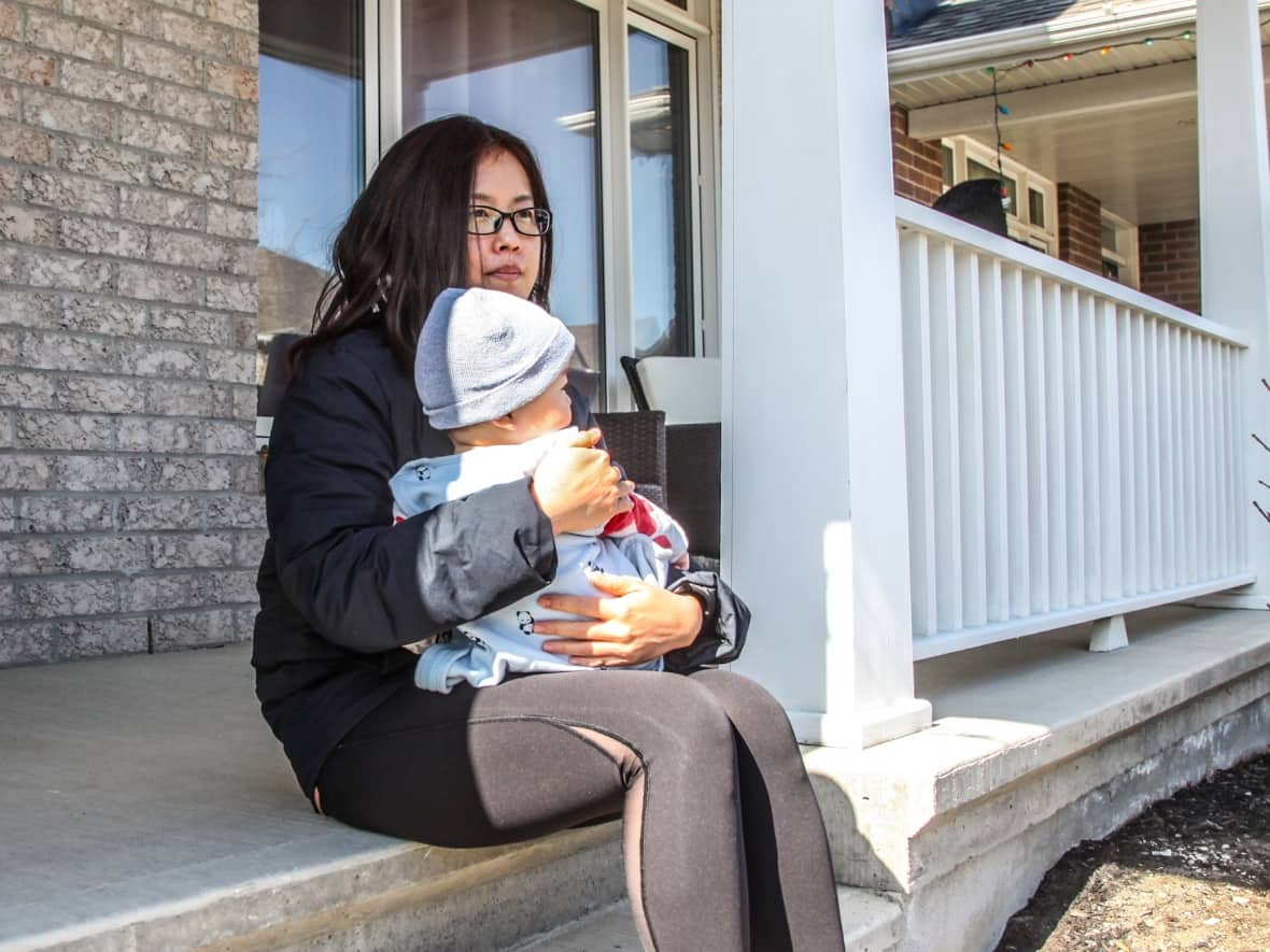 Camille Xu, a new mother, has lived with her family in Ottawa's Barrhaven suburb for seven years. (Stu Mills/CBC - image credit)