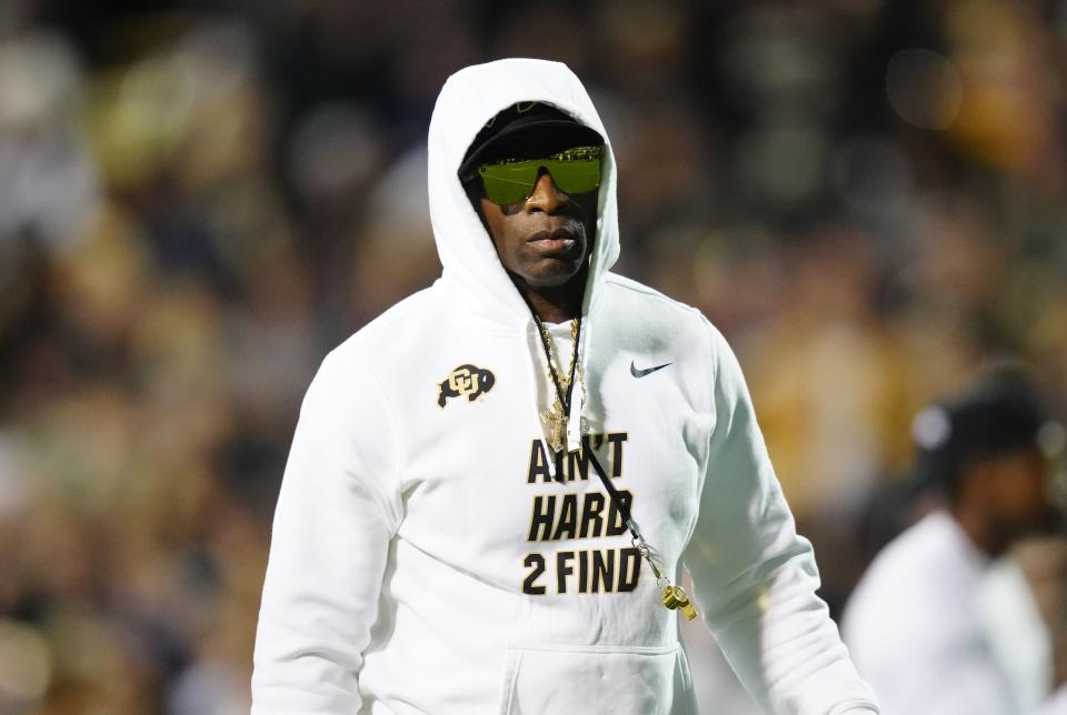 Colorado head coach Deion Sanders dons a pair of shades before the game against Colorado State.