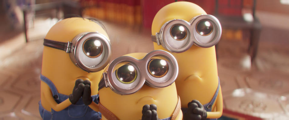 This image released by Universal Pictures shows Minions characters, from left, Stuart, Bob and Kevin in a scene from "Minions: The Rise of Gru." (Illumination Entertainment/Universal Pictures via AP)