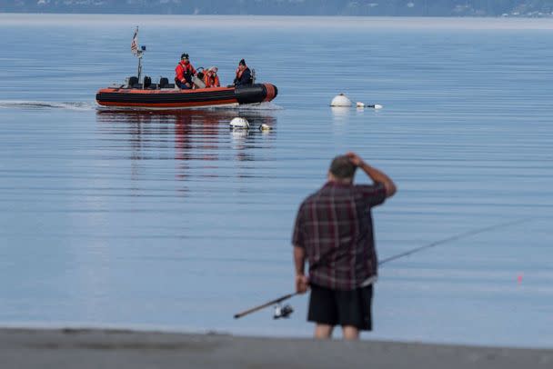 PHOTO: A U.S. Coast Guard vessel searches the area, Sept. 5, 2022, near Freeland, Wash., on Whidbey Island north of Seattle where a chartered floatplane crashed. (Stephen Brashear/AP)