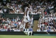 Dustin Brown of Germany hits a shot during his match against Rafael Nadal of Spain at the Wimbledon Tennis Championships in London, July 2, 2015. REUTERS/Stefan Wermuth -