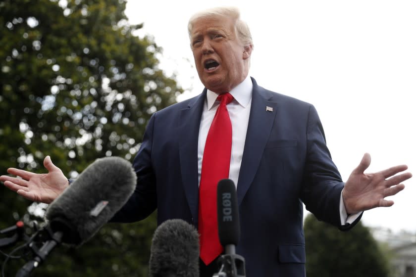 President Donald Trump speaks to members of the media on the South Lawn of the White House in Washington, Friday, July 10, 2020, before boarding Marine One for a short trip to Andrews Air Force Base, Md., and then on to Florida. (AP Photo/Andrew Harnik)