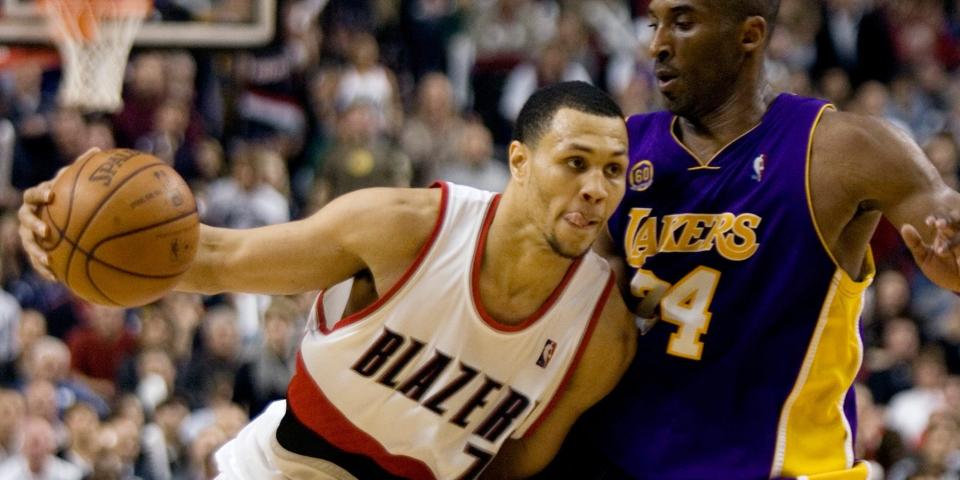 Brandon Roy dribbles past Kobe Bryant during a game in 2008.