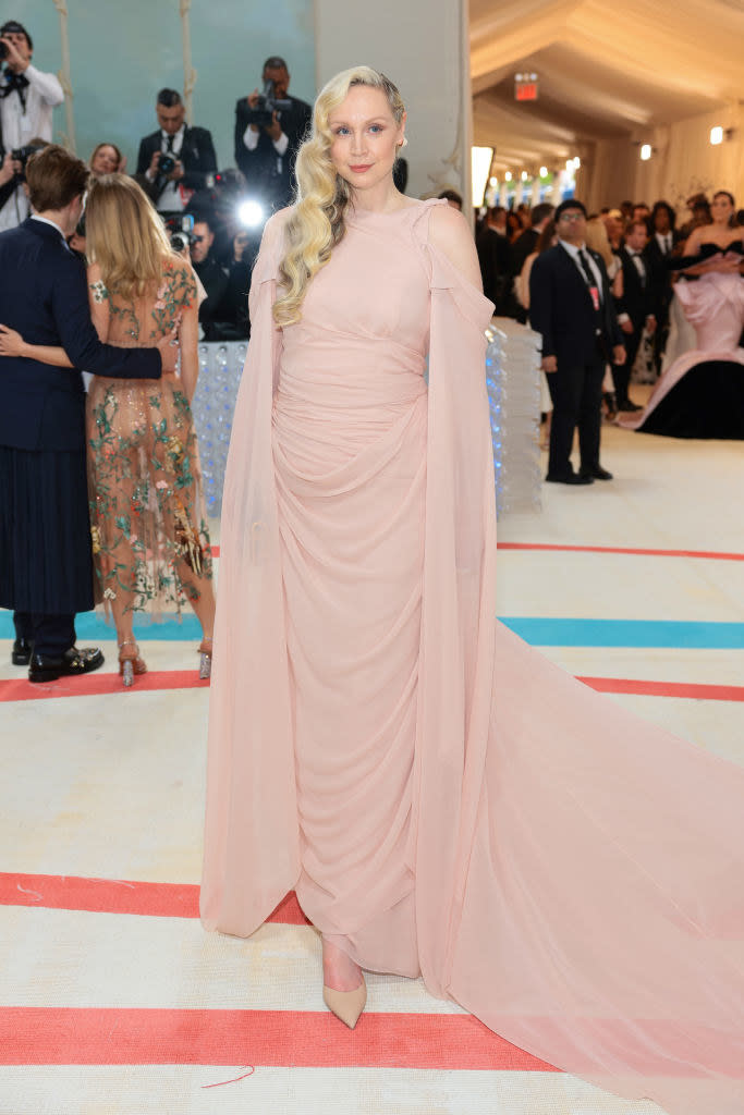 Gwendoline Christie attends The 2023 Met Gala in a pink gown