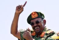 Sudanese President Omar Hassan al-Bashir gestures as he leads victory celebrations after the Sudanese Armed Forces (SAF) and the Rapid Support Forces (RSF) defeated the Justice and Equality Movement (JEM) rebels during his visit to the battle area of Gouz Dango in South Darfur April 28, 2015. REUTERS/Stringer