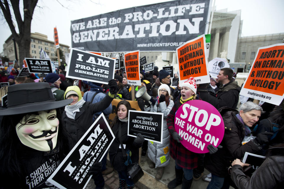 <span class="s1">Abortion rights activists face anti-abortion demonstrators in January 2013, the 40th anniversary of Roe v. Wade. (Photo: Manuel Balce Ceneta/AP)</span>