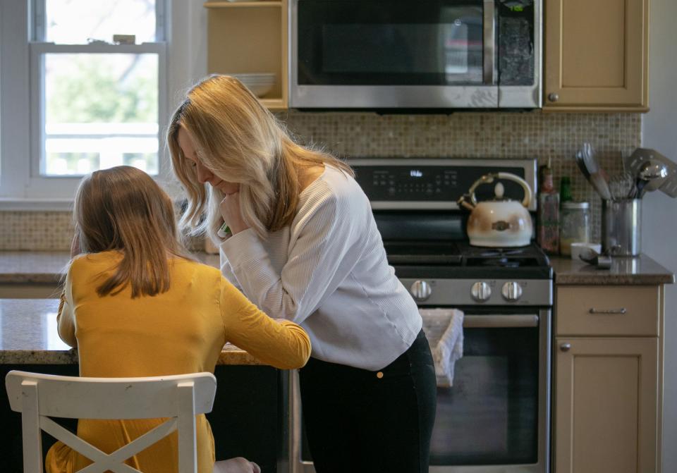 Farrah Eaton helps daughter Elin, 11, with home schooling on March 18, 2020 in New Rochelle, New York.