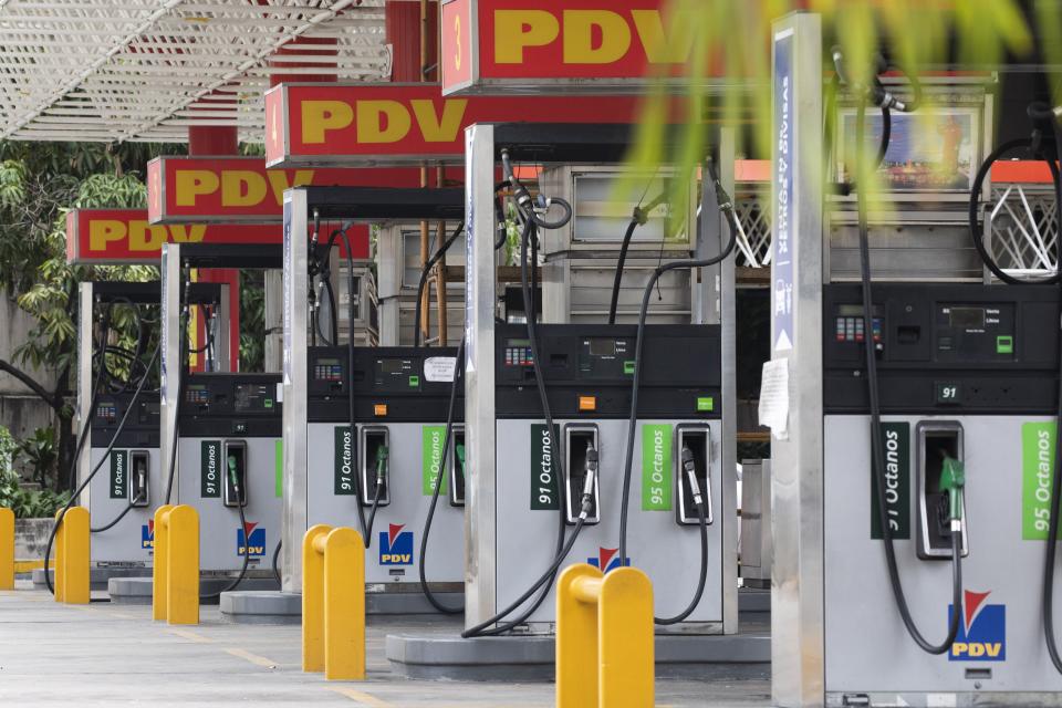 Closed gas pumps stand at a gas station in Caracas, Venezuela, Tuesday, Sept 8, 2020. Gasoline shortages have returned to Venezuela, sparking mile-long lines in the capital as international concerns mounted that Iran yet again may be trying to come to the South American nation's rescue. (AP Photo/Ariana Cubillos)