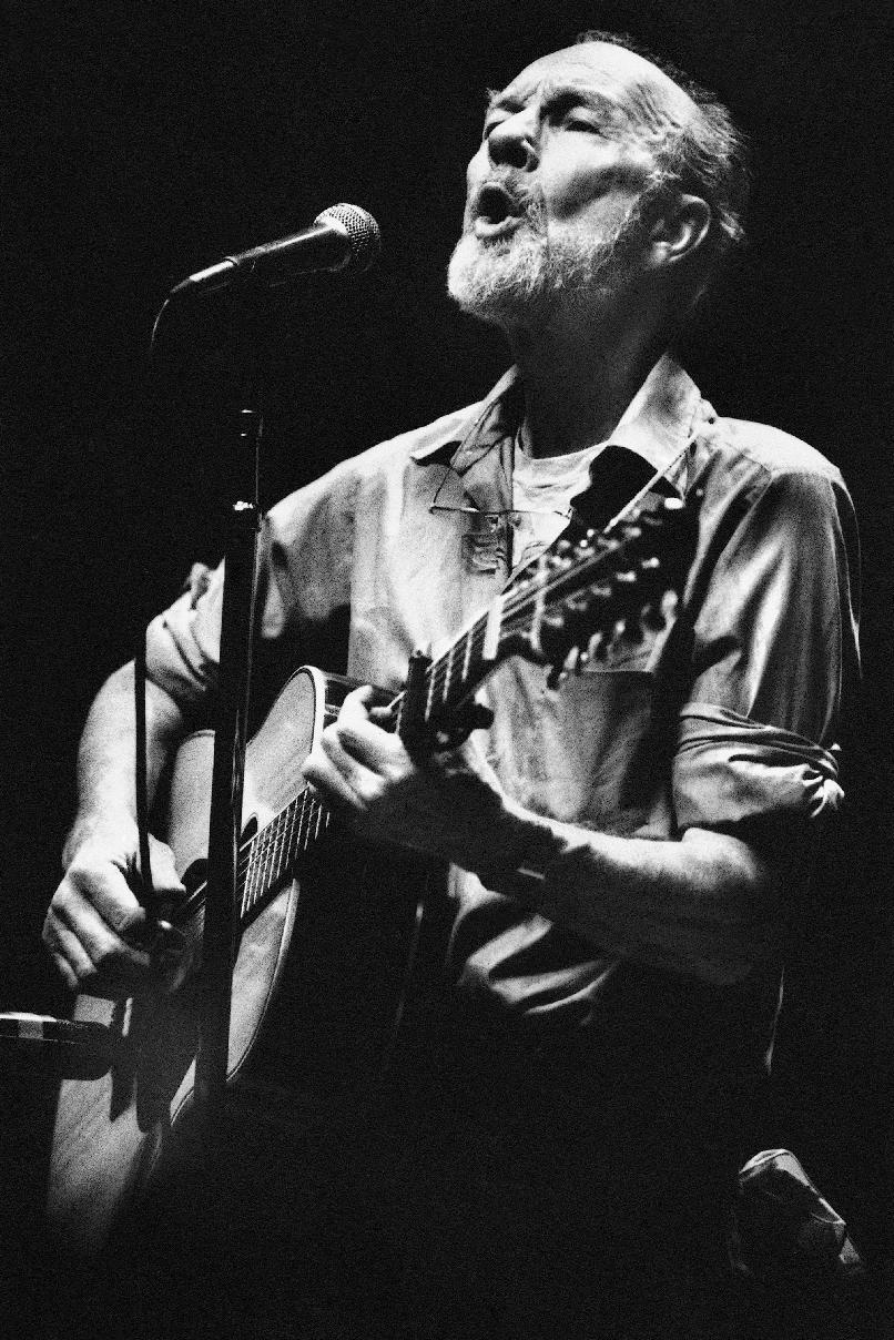 File- This Feb. 25, 1984, file photo shows folk singer Pete Seeger performing in a one-man benefit concert in Berkeley, Calif., at the Berkeley Community Theater. The American troubadour, folk singer and activist Seeger died Monday Jan. 27, 2014, at age 94. (AP Photo/Mark Costantini, File)