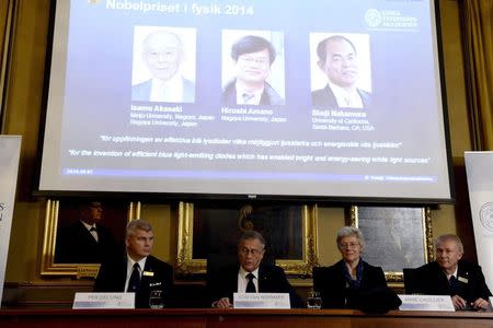 Physicists Per Delsing, Staffan Nordmark, Anne L'Huillier and Olle Inganas (seated L-R) announce Japanese scientists Isamu Akasaki and Hiroshi Amano, and U.S. scientist Shuji Nakamura (L-R) as the 2014 Nobel Physics Laureates at the Royal Swedish Academy of Science in Stockholm, October 7, 2014. REUTERS/Bertil Ericson/TT News Agency