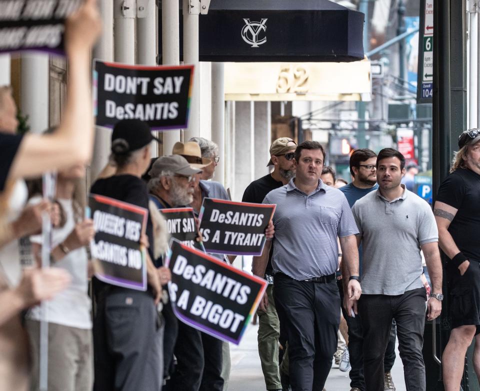 Protestors stand outside the Yale Club in Manhattan June 29, 2023 before Florida Governor  and presidential candidate Ron DeSantis arrived for a private fundraiser.