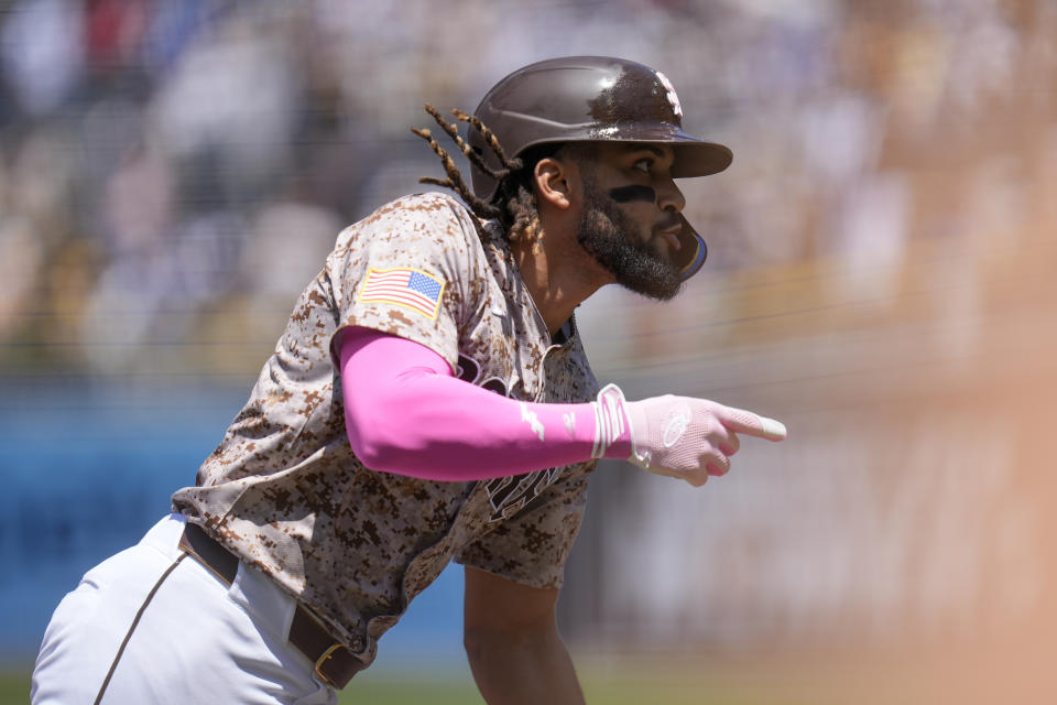 San Diego Padres' Fernando Tatis Jr. celebrates after hitting a home run during the first inning of a baseball game against the Los Angeles Dodgers, Sunday, May 12, 2024, in San Diego. (AP Photo/Gregory Bull)