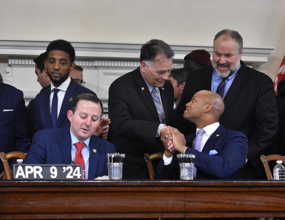 Gov. Wes Moore and Sen. Johnny Ray Salling shake hands at the signing of the PORT Act after working closely to respond to the collapse of the Francis Scott Key Bridge.