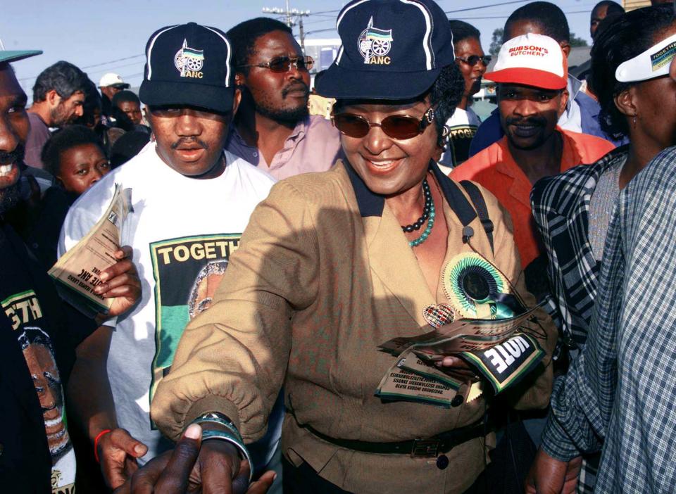 <p>Winnie Madikizela-Mandela meets voters during a tour in Flagstaff, South Africa, on May 20, 1999. Deputy President Thabo Mbeki, the most likely presidential candidate to succeed retiring President Nelson Mandela, said Thursday there would be no repeat of the violence that marred the first democratic election in 1994 when black and white South Africans vote together for the second time on June 2. (Photo: Juda Ngwenya/Reuters) </p>