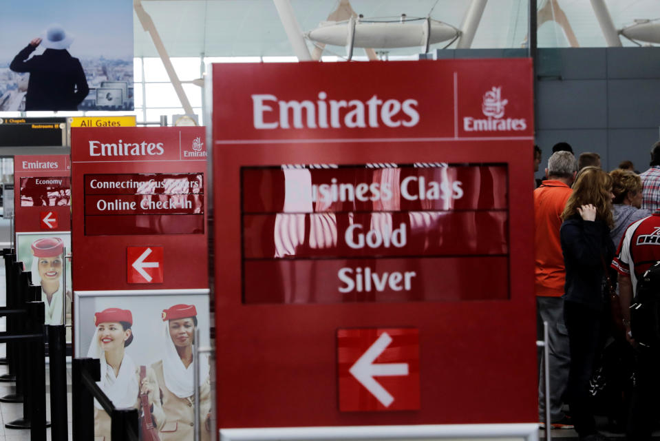 Signs point to the Emirates Airlines check in desks at JFK International Airport in New York, U.S., March 21, 2017. REUTERS/Lucas Jackson