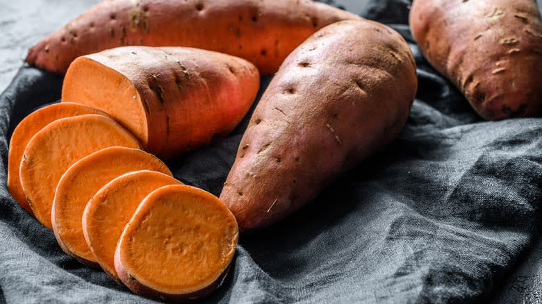 Whole and sliced sweet potatoes