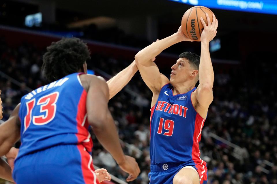 Detroit Pistons forward Simone Fontecchio (19) attempts a basket during the first half against the Dallas Mavericks at Little Caesars Arena in Detroit on Saturday, March 9, 2024.