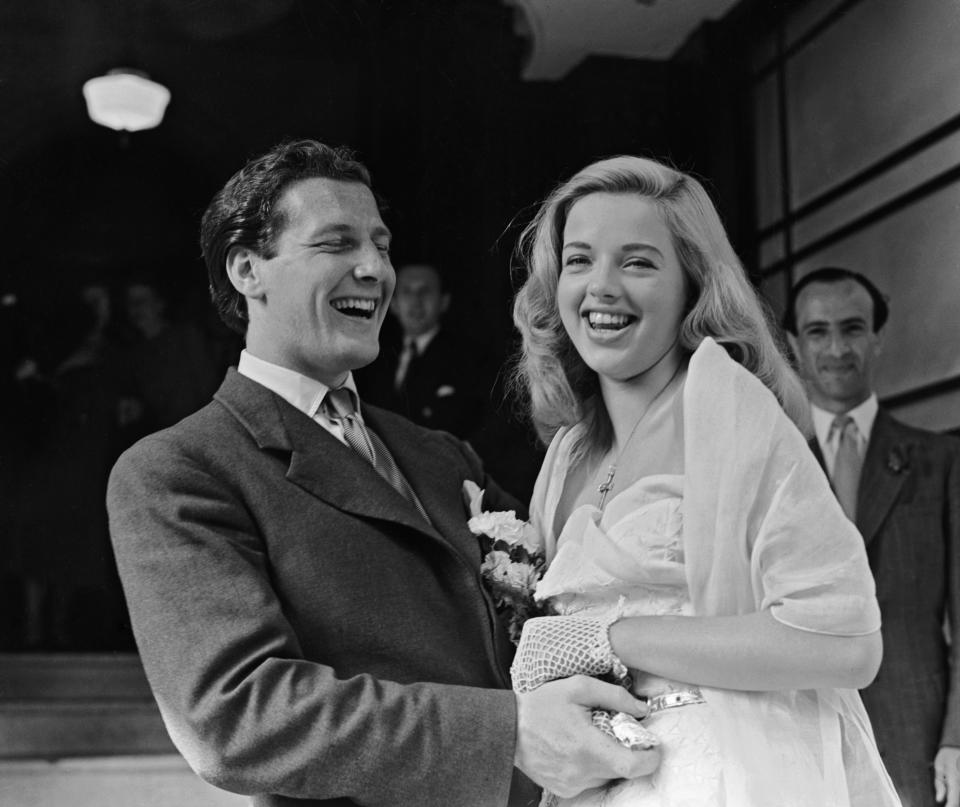 British actress Diana Dors (1931 - 1984) with her husband Dennis Hamilton after their wedding at Caxton Hall, Westminster, London, 3 July 1951. (Photo by Ron Case/Keystone/Hulton Archive/Getty Images)