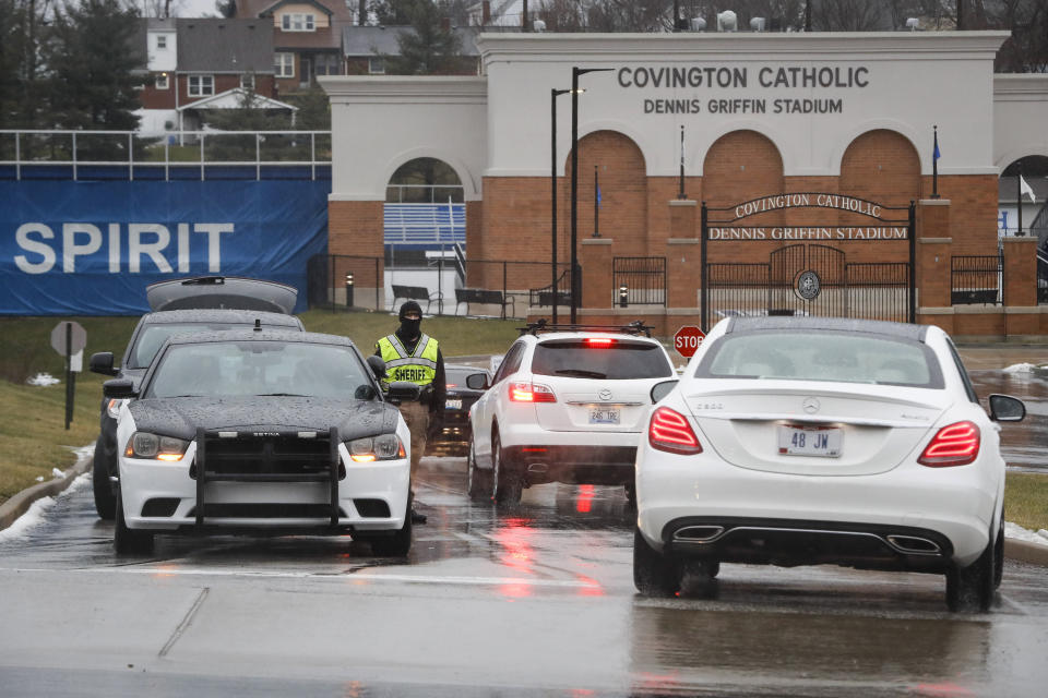 Students arrive at Covington Catholic High School as classes resume following a closing due to security concerns the previous day, Wednesday, Jan. 23, 2019, in Park Hills, Ky. A group of boys from the school went to Washington for an anti-abortion rally last Friday and their encounters with a Native American activist and a black religious sect were captured on video and spread on social media, drawing widespread criticism. (AP Photo/John Minchillo)