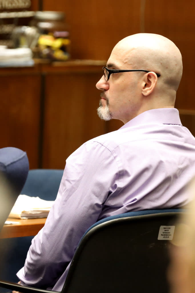 closeup of him sitting in the courtroom