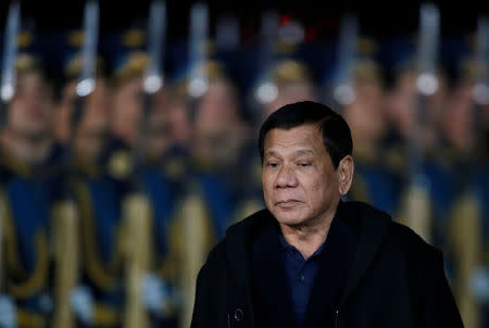 Philippine President Rodrigo Duterte inspects the honour guard during a welcoming ceremony upon his arrival at Vnukovo International Airport in Moscow, Russia, May 22, 2017. REUTERS/Maxim Shemetov