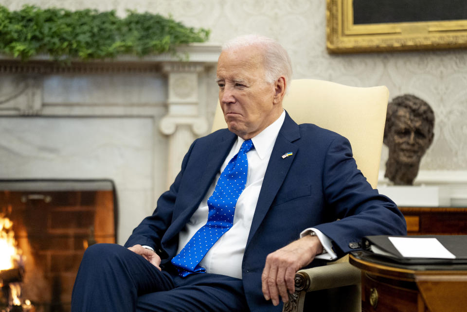 FILE - President Joe Biden sits in the Oval Office of the White House, Friday, Feb. 9, 2024, in Washington. Biden's team hopes it has found an unlikely opportunity to go on offense, and perhaps to unite an anxious Democratic Party, following the release of a special prosecutor's report on Thursday, Feb. 8, that cleared Biden of criminal charges, despite finding evidence that the president willfully retained and shared highly classified information as a private citizen. The counsel made repeated negative references to the 81-year-old president's age and memory that echo broader concerns raised by voters in both parties. (AP Photo/Andrew Harnik, File)