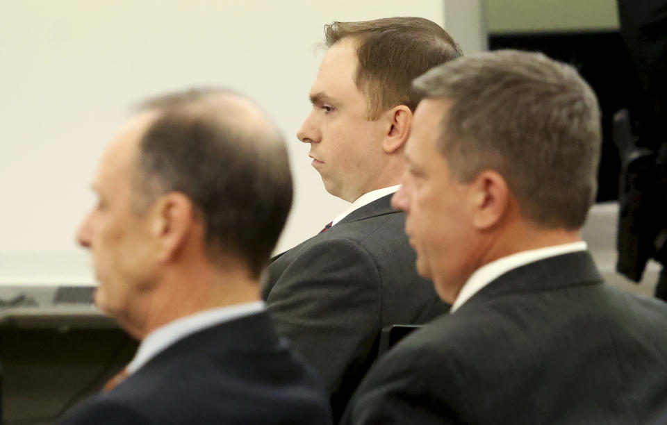 Aaron Dean, center, sits with his defense team after he was found guilty of manslaughter in the shooting death of Atatiana Jefferson, Thursday, Dec. 15, 2022, at the Tim Curry Criminal Justice Center in Fort Worth, Texas. Jefferson was fatally shot in Oct. 2019 when Dean, a former Fort Worth police officer, answered an open structure call at her residence. (Amanda McCoy/Fort Worth Star-Telegram via AP, Pool)