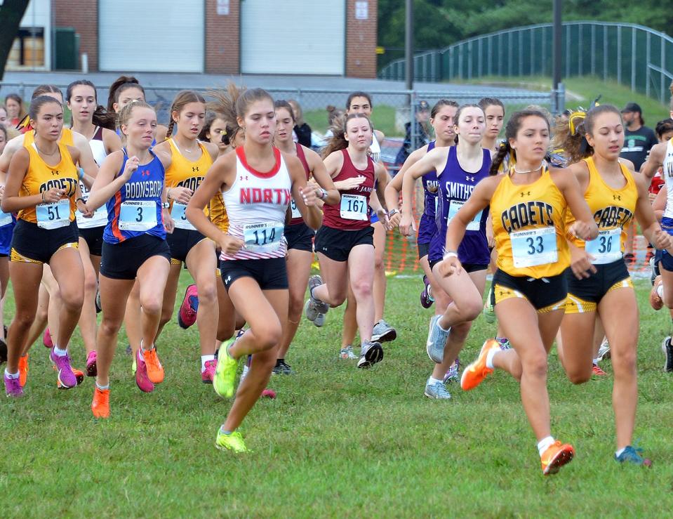 North Hagerstown's Lauren Stine (114) and Boonsboro's Caroline Matthews (3) start the Rebel Invitational girls race at South Hagerstown on Sept. 10, 2022.