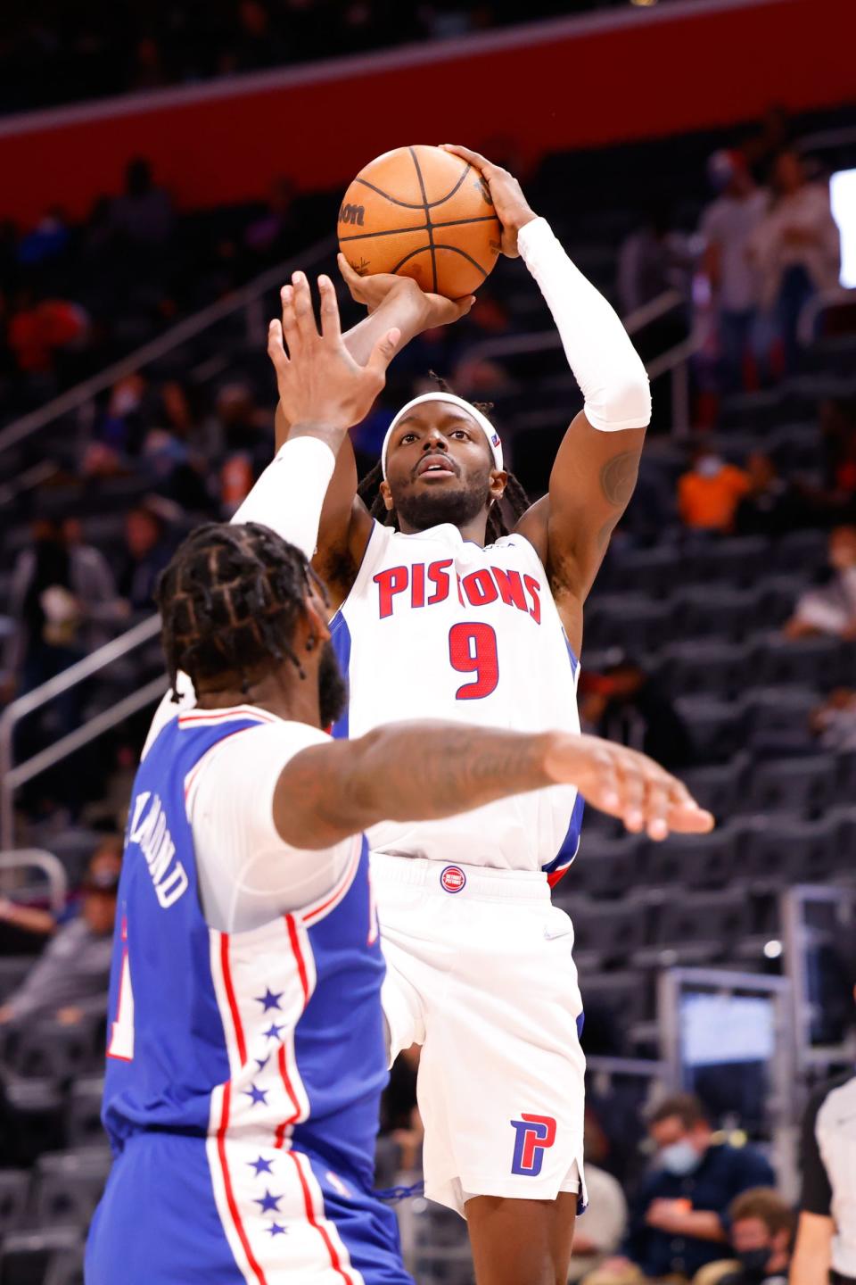 Detroit Pistons forward Jerami Grant (9) shoots over Philadelphia 76ers center Andre Drummond Scott (1) in the second half Oct. 15, 2021 at Little Caesars Arena.