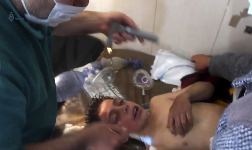 Syrian doctor treating a boy following a suspected chemical attack