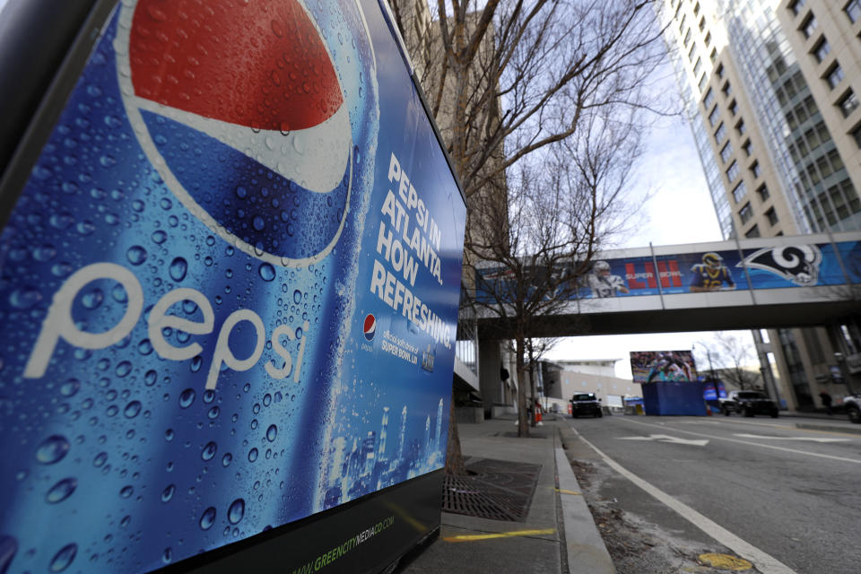 FILE- This Jan. 30, 2019, file photo an advertisement for Pepsi is shown downtown for the NFL Super Bowl 53 football game in Atlanta. PepsiCo Inc. reports earns on Friday, Feb. 15, 2019. (AP Photo/David J. Phillip, File)