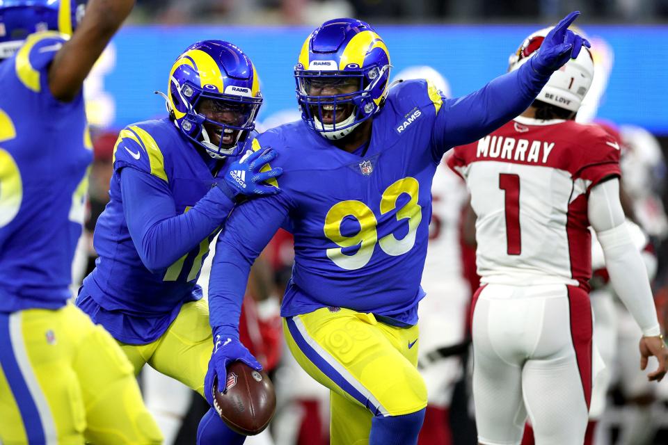 Marquise Copeland #93 of the Los Angeles Rams celebrates getting an interception with teammates in the second quarter of the game against the Arizona Cardinals in the NFC Wild Card Playoff game at SoFi Stadium on January 17, 2022 in Inglewood, California.