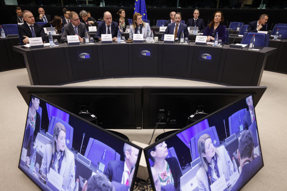 Roberta Metsola, President of European Parliament, center, meets the presidents of political groups in a special meeting to decide the impeachment of the vice president Eva Kaili, at the European Parliament in Strasbourg, eastern France, Tuesday Dec 13, 2022. The European Union's parliament was reeling Tuesday, it's credibility under threat, as a corruption and bribery scandal damaged lawmakers' careers and fingers pointed at Qatari officials accused of seeking to play down labor rights concerns ahead of the soccer World Cup. (AP Photo/Jean-Francois Badias)