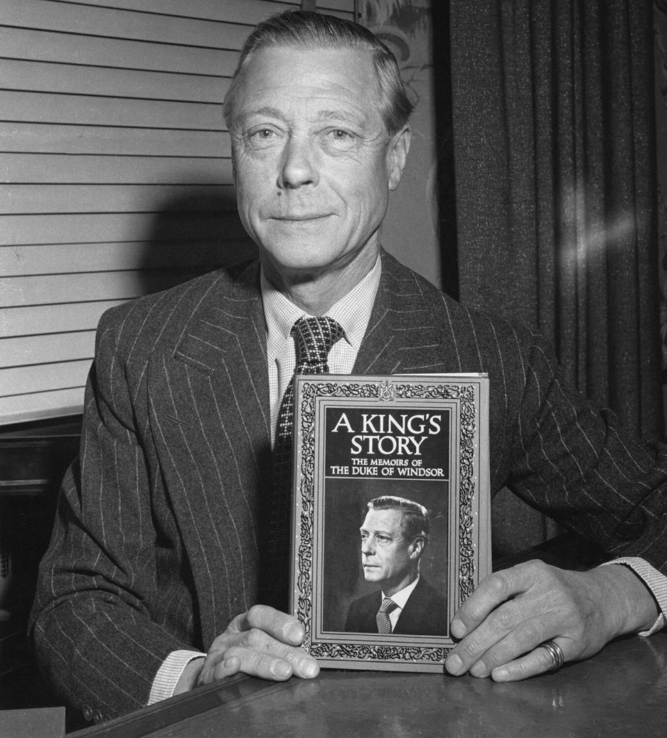 The Duke of Windsor (1894 - 1972), formerly King Edward VIII, with his memoirs, entitled 'A King's Story: The Memoirs of the Duke of Windsor', circa 1951.