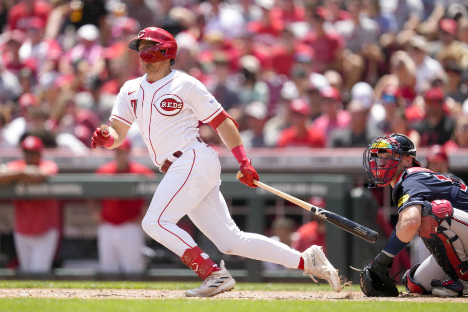 Cincinnati Reds' Spencer Steer, left, watches his RBI double against the Atlanta Braves during the third inning of a baseball game Sunday, June 25, 2023, in Cincinnati. (AP Photo/Jeff Dean)