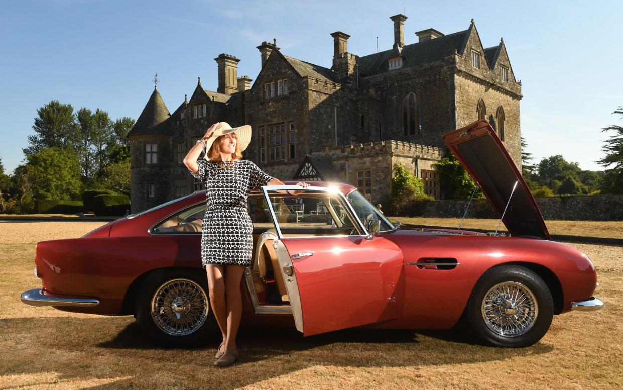 Sarah Jane Seaborn from north Dorset with her Duboni Rosso Aston Martin DB4 Vantage built in 1962 in front of Palace House - Â©Russell Sach - 0771 882 6138